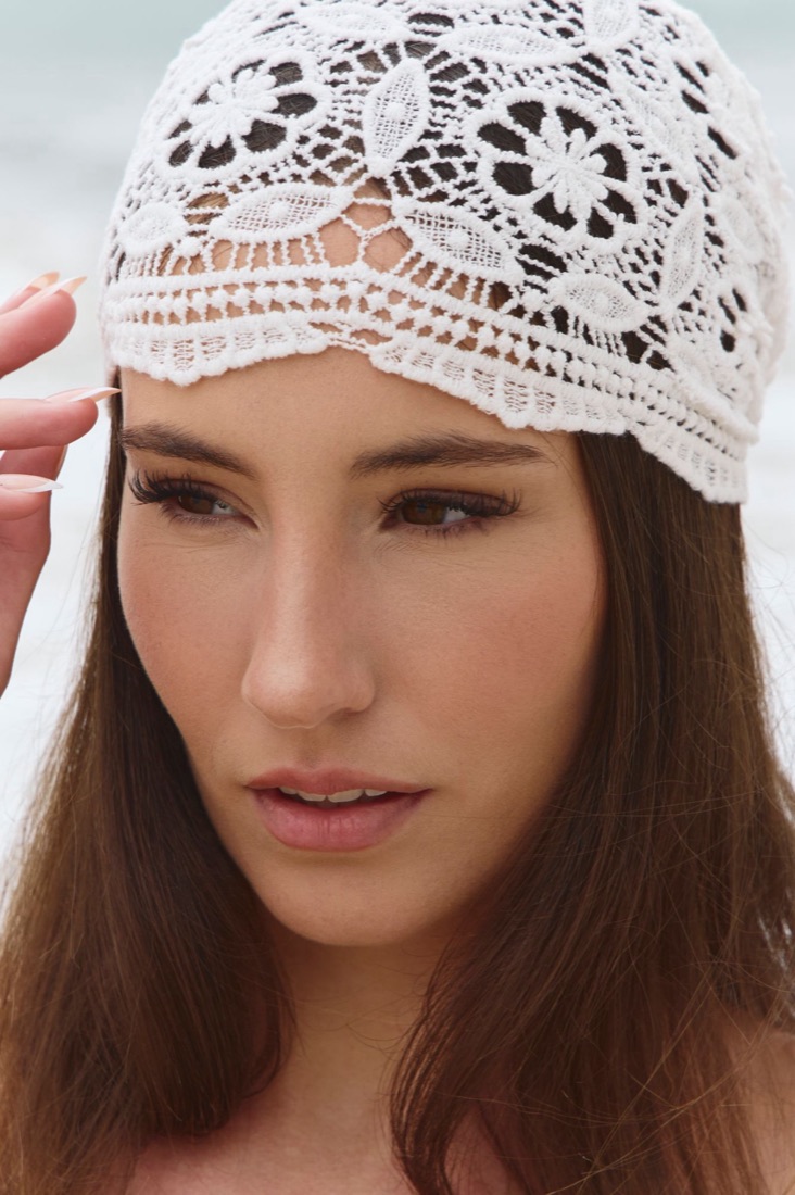 Soft editorial makeup with a lace headpiece