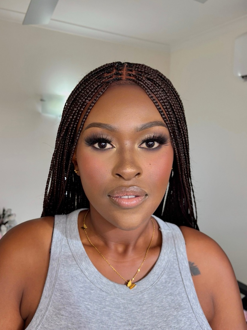 Bronzed soft glam with a smoky eye and glossy nude lip